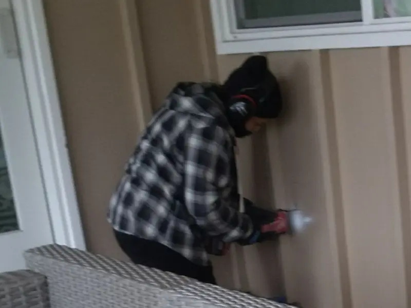 Professional electrician installing an exterior outlet in Hartford