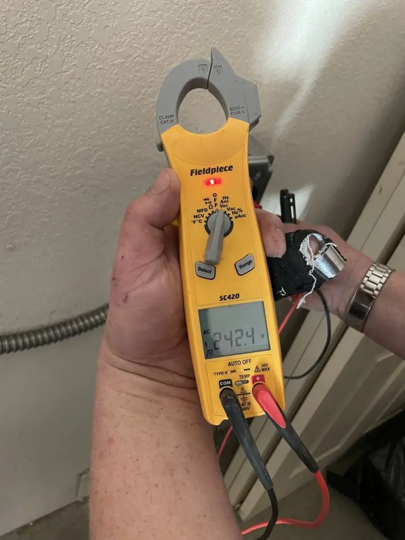 Voltage testing with clamp meter during Whole House Surge Protector in Hartford